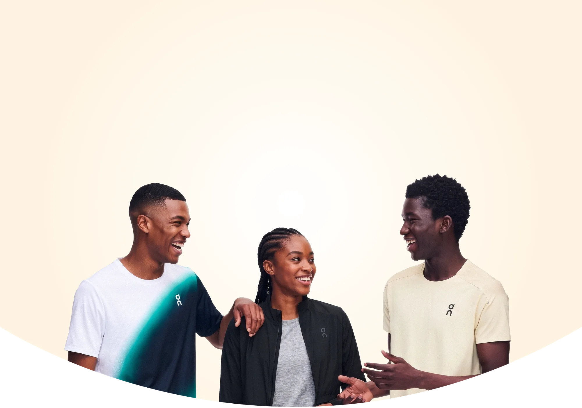 Three young Kenyan creatives laughing together, wearing On apparel